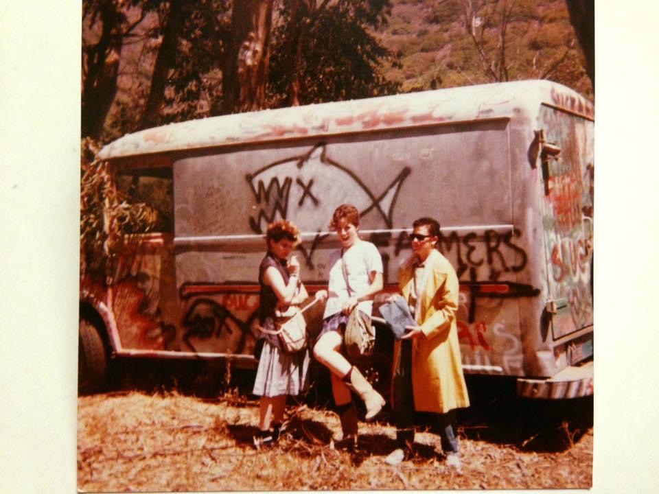 Ruby Dee Philippa and 2 friends standing in front of the FLIPPER band van
